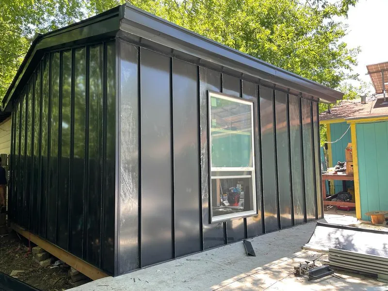 Black standing seam metal wall panels for Roof Inspection in Rawlins